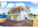 Attractive two-story white home with a screened porch and sliding glass doors at 4601 Lewis St., North Myrtle Beach, SC 29582