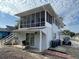 Exterior view of the house with screened porch and car parked outside at 4601 Lewis St., North Myrtle Beach, SC 29582