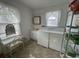 Bright laundry area with washer, dryer, vanity and shelf rack at 4601 Lewis St., North Myrtle Beach, SC 29582