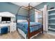 Bright bedroom featuring a four-poster bed, desk, and ample storage at 4872 Dahlia Ct. # 202, Myrtle Beach, SC 29577