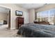 Comfortable bedroom featuring a queen bed, dresser with television and a large window at 4872 Dahlia Ct. # 202, Myrtle Beach, SC 29577