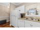 Well-lit kitchen with white cabinets and a stainless steel sink at 4872 Dahlia Ct. # 202, Myrtle Beach, SC 29577