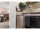 Modern laundry room with front loading machines and storage shelving at 4872 Dahlia Ct. # 202, Myrtle Beach, SC 29577