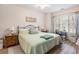 Serene bedroom featuring wood floors, a comfortable bed and a relaxing ambiance at 4882 Luster Leaf Circle # 305, Myrtle Beach, SC 29577