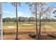 Scenic view of the golf course from the community surrounded by tall pine trees at 4882 Luster Leaf Circle # 305, Myrtle Beach, SC 29577