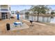 Relaxing patio area with table, chairs, and grill overlooking a serene pond at 4882 Luster Leaf Circle # 305, Myrtle Beach, SC 29577