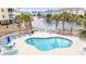 Inviting outdoor pool area with comfortable lounge chairs and palm trees at 4882 Luster Leaf Circle # 305, Myrtle Beach, SC 29577