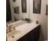 Bathroom featuring a white countertop and a dark wood vanity under a large mirror at 4905 Britewater Ct. # 202, Myrtle Beach, SC 29579