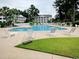 Large community swimming pool with ample seating and surrounding landscaping at 4905 Britewater Ct. # 202, Myrtle Beach, SC 29579