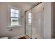 Bathroom featuring a glass-enclosed shower, window, and wooden-look flooring at 4975 Dupont Rd., Conway, SC 29526