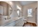 Stylish bathroom with double vanity, framed mirrors and modern fixtures at 4975 Dupont Rd., Conway, SC 29526