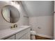 Bathroom featuring a single vanity, modern fixtures, mirror and wood-look flooring at 4975 Dupont Rd., Conway, SC 29526