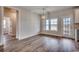 Dining area with hardwood floors, modern lighting, and access to a large back yard at 4975 Dupont Rd., Conway, SC 29526