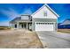 Charming two-story home with white siding, attached two car garage and covered entry at 4975 Dupont Rd., Conway, SC 29526