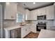 Modern kitchen features stainless steel appliances, white cabinets and designer backsplash at 4975 Dupont Rd., Conway, SC 29526