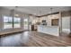 Bright kitchen with white cabinets, stainless steel appliances, and hardwood floors at 4975 Dupont Rd., Conway, SC 29526