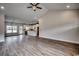 Spacious living room flows into the kitchen, featuring hardwood floors and natural light at 4975 Dupont Rd., Conway, SC 29526