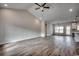 Bright open-concept living room featuring hardwood floors, vaulted ceilings, and natural light at 4975 Dupont Rd., Conway, SC 29526