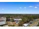 Aerial view of the property in a community surrounded by lush greenery and scattered homes at 5002 Watergate Dr., Myrtle Beach, SC 29588