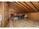 Unfinished attic space with exposed wood framing and storage at 5002 Watergate Dr., Myrtle Beach, SC 29588