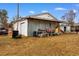 Backyard featuring outbuildings and a shed with a roll-up door at 5002 Watergate Dr., Myrtle Beach, SC 29588