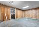 Spacious unfinished basement with wood paneled walls and open access to another room at 5002 Watergate Dr., Myrtle Beach, SC 29588