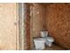 Unfinished basement bathroom with toilet and exposed wall studs at 5002 Watergate Dr., Myrtle Beach, SC 29588