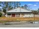 Exterior elevation of the two-story home with front porch at 5002 Watergate Dr., Myrtle Beach, SC 29588