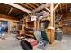 Expansive garage with wood beams, shelving, and ample space for storage or creative projects at 5002 Watergate Dr., Myrtle Beach, SC 29588