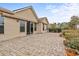 The backyard features a stone-paved patio connected to the home via a sliding glass door at 5230 Piemonte Ln., Myrtle Beach, SC 29579