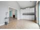 Bonus room with tile flooring, white cabinets, and a view into the living room at 5230 Piemonte Ln., Myrtle Beach, SC 29579