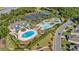 Resort-style pool area boasts multiple pools, seating, and lush landscaping, perfect for relaxation at 5230 Piemonte Ln., Myrtle Beach, SC 29579