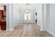Elegant entryway with hardwood floors, stately columns, and a decorative front door at 5230 Piemonte Ln., Myrtle Beach, SC 29579