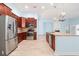 Well-equipped kitchen with stainless steel appliances, tile backsplash, and hardwood flooring at 5230 Piemonte Ln., Myrtle Beach, SC 29579