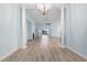 Bright living room showcasing hardwood floors, a fireplace, and French doors leading to outdoor space at 5230 Piemonte Ln., Myrtle Beach, SC 29579