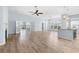 Open living area with hardwood floors, a fireplace, and French doors leading to a patio at 5230 Piemonte Ln., Myrtle Beach, SC 29579