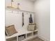 Functional mudroom area featuring a built-in bench with cubbies, hooks, and decorative pillows at 530 Haven View Way, Murrells Inlet, SC 29576