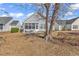 Backyard featuring a screened porch and a small grassy area at 537 Sand Ridge Rd., Conway, SC 29526