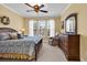 Comfortable bedroom with a ceiling fan, natural light from the windows, and a dresser at 537 Sand Ridge Rd., Conway, SC 29526