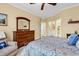 Bedroom featuring neutral walls, a wooden dresser, and access to the bathroom and closet at 537 Sand Ridge Rd., Conway, SC 29526