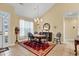 The formal dining room features a chandelier, large windows and opens to other rooms at 537 Sand Ridge Rd., Conway, SC 29526