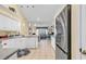 A full kitchen with tile floors, stainless steel appliances, and a view into the Gathering room at 537 Sand Ridge Rd., Conway, SC 29526