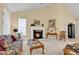 Inviting living room with a fireplace features two couches, neutral carpet, and plenty of natural light at 537 Sand Ridge Rd., Conway, SC 29526