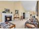 Inviting living room with a fireplace features two couches, neutral carpet, and plenty of natural light at 537 Sand Ridge Rd., Conway, SC 29526