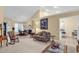 A living room view into the dining room with tiled floors and a floral sofa at 537 Sand Ridge Rd., Conway, SC 29526