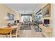 A living room dining area is displayed with tiled floors, bright colors, and plenty of sunlight at 537 Sand Ridge Rd., Conway, SC 29526