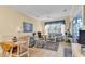 A living room dining area is displayed with tiled floors, bright colors, and plenty of sunlight at 537 Sand Ridge Rd., Conway, SC 29526