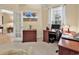 This office features carpet flooring, two desks, and a TV with a beach scene displayed on the wall at 537 Sand Ridge Rd., Conway, SC 29526