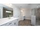 Bathroom featuring dual vanities, a glass-enclosed shower and modern fixtures at 546 Haven View Way, Murrells Inlet, SC 29576