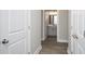 Hallway leading to bathroom with tile floor and neutral paint at 546 Haven View Way, Murrells Inlet, SC 29576